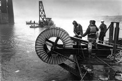 Crew laying nautical cable (THG file photo).